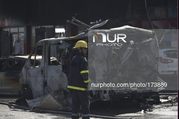 Fire Fighters at the scene of a gas station in Ashdod that was hit directly by rocket fire from Gaza on the fourth day of Operation Protecti...