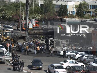 Fire Fighters at the scene of a gas station in Ashdod that was hit directly by rocket fire from Gaza on the fourth day of Operation Protecti...