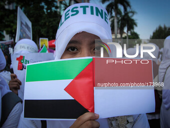 SEMARANG, INDONESIA - JULY 11: Indonesian muslims protest the airstrikes of Israel to Gaza in Semarang, Central Java, Indonesia on July 11,...