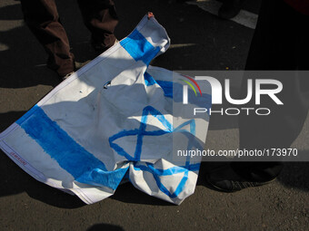 SEMARANG, INDONESIA - JULY 11: Indonesian muslims protest the airstrikes of Israel to Gaza by burning Israeli flags in Semarang, Central Jav...