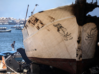 Smoke rises from the peace activists boat 'Gaza's Ark' following an Israeli air strike during the fighting between Israeli navy and Hamas mi...