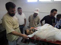 Photos from inside the Shifa Hospital for the martyrs were killed in the Shojae'ya east of Gaza City, on July 12, 2014. (
