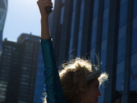 ‘Lady Liberty’ dances during the ‘Not My President’s Day’ rally near Trump International Hotel and Tower, at Central Park West, New York Cit...