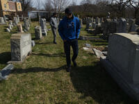Small group of Muslims from New Jersey visit the Mt. Carmel Jewish Cemetery in Northwest Philadelphia, PA, on Feb. 27, 2017. Over the weeken...