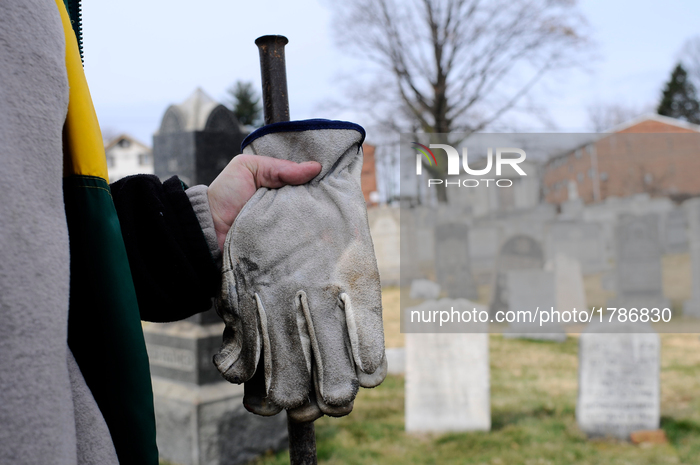 People assess the damage after hundreds of headstones got vandalized at Mt. Carmel Jewish Cemetery in Northwest Philadelphia, PA, on Feb. 27...