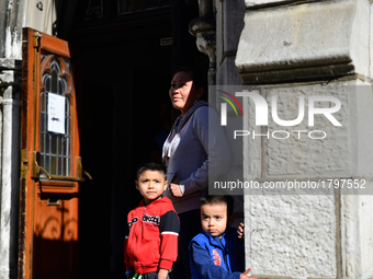 Members of the Flores family stand at the door as hundreds visit Javier Flores, an immigrant from Mexico, at his Sanctuary, at Arch Street U...