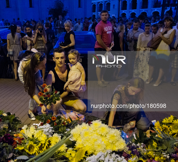 KIEV, UKRAINE - JULY 18: People lay flowers under the Netherlands Embassy in Kiev feeling for victims of Malaysia Airlines plane shot down b...