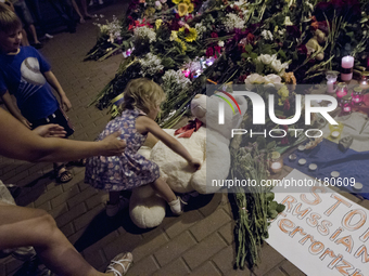 KIEV, UKRAINE - JULY 18: Kid brings her toy bear the Netherlands Embassy in Kiev feeling for victims of Malaysia Airlines plane shot down by...