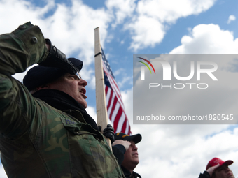 Veterans salut the American flag during the Pledge of Allegiance at a pro-trump rally in Bensalem, PA, on March 4th, 2017.
Similar small eve...