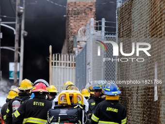 Firefighters stand by as Philadelphia Fire Department responds to a PECO Substation fire, on March 7th, 2017, in Philadelphia, PA. The fire...