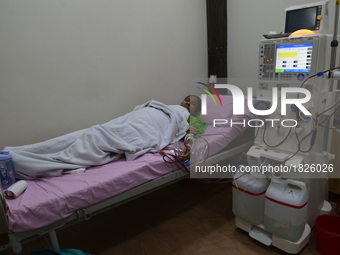 A Female dialysis patient getting their blood cleaned by dialysis machine at National Institute of Kidney Diseases and Urology in Dhaka, Ban...