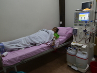 A Female dialysis patient getting their blood cleaned by dialysis machine at National Institute of Kidney Diseases and Urology in Dhaka, Ban...