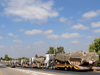 UNSPECIFIED, ISRAEL - JULY 19, 2014: A military convoy carrying APCs near Israel's border with the Gaza Strip, on July 19, 2014,  on the sec...