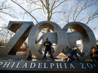 School children play at the large sing near the entrance of the Philadelphia Zoo, in Philadelphia, PA, on April 3, 2017. The popular tourist...