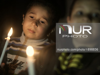 Palestinian boys hold candles during a protest against the blockade on Gaza, in Gaza City April 14, 2017. 
 (