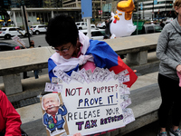 Protestors gather in Center City Philadelphia, PA, ahead of the April 15 Tax Day March. Around the nation thousands are expected to particip...