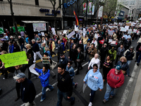Protestors march on Market Street  during a Tax Day protest in Center City Philadelphia, on April 15, 2017. Around the nation thousands are...