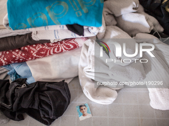After the family left the rocket-damaged house in Sderot some personal belongings, family photos and clothing, were left behind. (