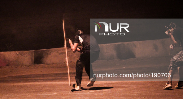 Bahrain , Abu Saiba - protester hiding behind a shield during the clashes ,  demonstration followed by clashes in Abu Saiba village in a wel...