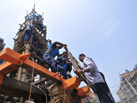 Devotees arranging piles of wood for making the chariot of Idol Rato Machindranath 'Rain of God' at Pulchowk, Laltipur, Nepal on Friday, Apr...