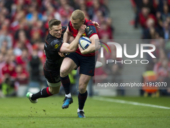 Keith Earls of Munster tackled by Chris Ashton of Saracens during the European Rugby Champions Cup Semi-Final match between Munster Rugby an...