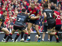 Simon Zebo of Munster tackled by Jamie George of Saracens during the European Rugby Champions Cup Semi-Final match between Munster Rugby and...