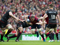 Tommy O'Donnell of Munster tackled by Jamie George of Saracens during the European Rugby Champions Cup Semi-Final match between Munster Rugb...