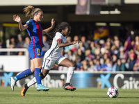 Aminata Diallo of Paris Saint Germain defended by  Alexia Putellas of FC Barcelona during the semifinals of UEFA Womens Champions League mat...