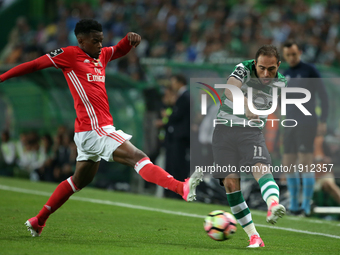 Sporting's Brazilian midfielder Bruno Cesar (R ) vies with Benfica's Portuguese defender Nelson Semedo during the Portuguese League football...