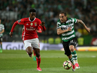 Sporting's Brazilian midfielder Bruno Cesar (R ) vies with Benfica's Portuguese defender Nelson Semedo during the Portuguese League football...