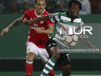 Sporting's forward Gelson Martins (R) vies with Benfica's Spanish defender Alex Grimaldo during the Portuguese League  football match betwee...
