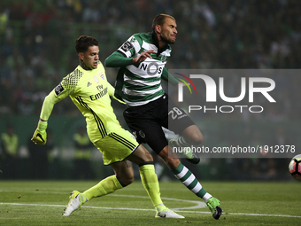 Benfica's Brazilian goalkeeper Ederson Moraes (L) vies with Sporting's forward Bas Dost during the Portuguese League  football match between...