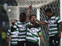 Sporting's midfielder Adrien Silva (2ndR) celebrates with Sporting's midfielder William Carvalho(L) and Sporting's midfielder Alan Ruiz afte...