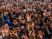 Kashmiri Muslims shout anti Indian and pro Kashmir freedom slogans as they attend the funeral procession of   Younis Maqbool Ganie, a pro Ka...