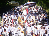 Thousands of Balinese Hindu, Indonesia, in jimbaran village walk as far as 15 kilometers to Uluwatu Temple, to do tradition of 'Ngiring Ida...