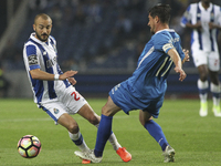 Porto's Portuguese midfielder Andre Andre (L) compete the ball with Feirense player Cris (R) during the Premier League 2016/17 match between...