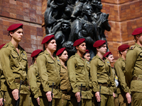 Israeli soldiers take part in a ceremony marking the annual Holocaust Remembrance Day at the Yad Vashem Holocaust memorial in Jerusalem, Isr...