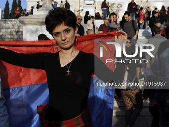 An Armenian woman with the Armenian flag takes part to a protest rally, at Syntagma square, in central Athens, on Monday April 24, 2017. Hun...