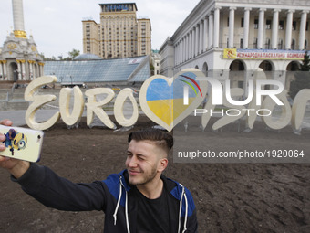 A man takes a selfie photo in front the Eurovision Song Contest 2017 logo is seen on Independence Square in Kiev, Ukraine, 26 April, 2017. T...