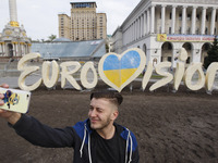 A man takes a selfie photo in front the Eurovision Song Contest 2017 logo is seen on Independence Square in Kiev, Ukraine, 26 April, 2017. T...