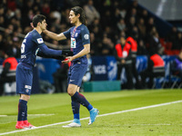 Paris Saint-Germain's Uruguayan forward Edinson Cavani (R) cheers Paris Saint-Germain's Portuguese forward Goncalo Guedes (L) as he leaves t...