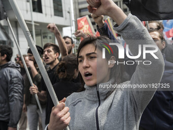 Protesters chant slogans and block a street during a May Day demonstration on May 1, 2017 in Istanbul, Turkey. Small sporadic protests occur...