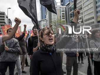 Protesters chant slogans and block a street during a May Day demonstration on May 1, 2017 in Istanbul, Turkey. Small sporadic protests occur...