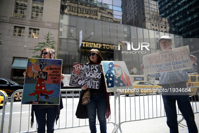 Patrice LaMarina, Barbara Smucker and Bill Johnson protests outside Trump Tower as NYC prepares for first return of US President Donald Trum...