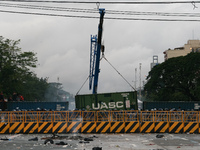 Police place container vans along Commonwealth Avenue as a safeguard in blocking the protesters from reaching Batasan Pambansa in Quezon Cit...