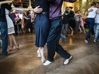 Dancers perfom Argentine tango during an afternoon milonga event in Hevre Pub, an event that was a part of Krakus Aires Tango Festival 2017,...