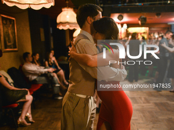 A couple perfoms Argentine tango during an afterparty event in Klub Cabaret, an event that was a part of Krakus Aires Tango Festival 2017, a...