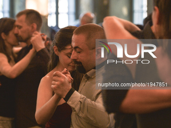 Couples perfom Argentine tango during an afternoon milonga event in Hevre Pub, an event that was a part of Krakus Aires Tango Festival 2017,...
