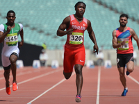 Andrew Fisher (Center) of Bahrain on his way to win Men's 100m Qualification Round - Heat 4, during day five of Baku 2017 - 4th Islamic Soli...