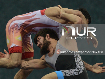 Soner Demirtas of Turkey competes against Bekzod Abdurakhmonov of Uzbekistan in the Mens Freestyle Wrestling 74kg semi-finals during day eig...